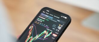 a person holding a cell phone in their hand