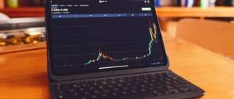 a laptop computer sitting on top of a wooden desk