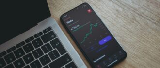 black android smartphone on macbook pro