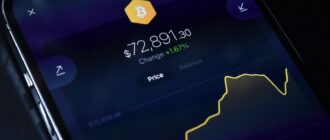 a cell phone displaying bitcoin on the screen