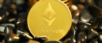 a gold coin sitting on top of a pile of rocks