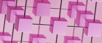 a bunch of pink cubes hanging from a pink wall