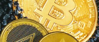 a bitcoin sitting on top of a pile of coins